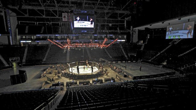 Fighters battle without spectators during a UFC 249 mixed martial arts bout, Saturday, May 9, 2020, in Jacksonville, Fla. (AP Photo/John Raoux)