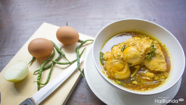 Opor ayam, chicken cooked in coconut milk from Central Java, Indonesia. Served with lontong and sambal. Popular dish for lebaran or Eid al-Fitr
