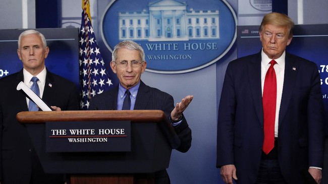 FILE - In this April 17, 2020, file photo, President Donald Trump and Vice President Mike Pence listen as Dr. Anthony Fauci, director of the National Institute of Allergy and Infectious Diseases, speaks about the coronavirus in the James Brady Press Briefing Room of the White House in Washington. The Trump administration’s leading health experts on safely dealing with the novel coronavirus will be testifying in a Senate hearing by a videoconference after three of them and the committee's chairman were exposed to someone who tested positive for COVID-19. (AP Photo/Alex Brandon, File)