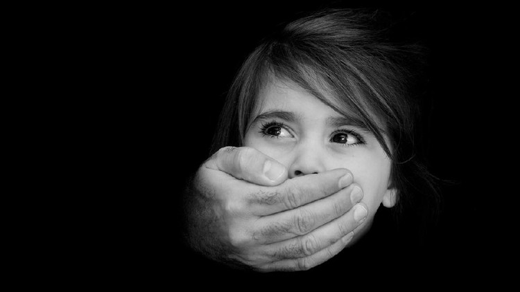 Strong male hands cover little girl face with emotional stress, pain, afraid, call for help, struggle, terrified expression.Concept Photo of abduction, missing, kidnapped,victim, hostage, abused child