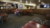 Restoran di Amerika Mulai Dibuka Kembali Customers have lunch at The Friendly Tavern, Monday, May 11, 2020, in Zionsville, Ind. Dine-in restaurants in most Indiana counties were allowed to open at 50 percent capacity. (AP Photo/Darron Cummings)