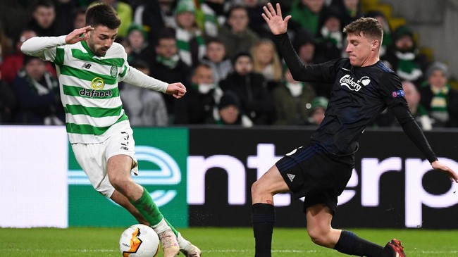 Celtic's Scottish defender Greg Taylor (L) vies with FC Copenhagen's Spanish midfielder Pep Biel (R) during the UEFA Europa League round of 32 second leg football match between Celtic and Copenhagen at Celtic Park stadium in Glasgow, Scotland on February 27, 2020. (Photo by ANDY BUCHANAN / AFP)
