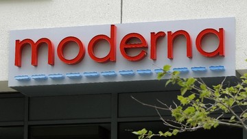 A sign marks an entrance to a Moderna, Inc., building, Monday, May 18, 2020, in Cambridge, Mass. Moderna announced Monday, May 18, 2020, that an experimental vaccine against the coronavirus showed encouraging results in very early testing, triggering hoped-for immune responses in eight healthy, middle-aged volunteers.(AP Photo/Bill Sikes)