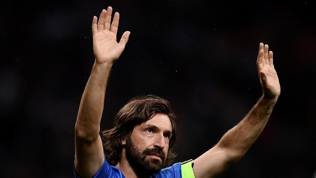 Former Italian football player Andrea Pirlo waves at the end of the 