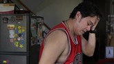Dilema Dokter Positif Covid-19 di Filipina In this May 11, 2020 photo, anesthesiologist Manuel Sotelo III wipes sweat from his head as he arrives from work at their house at San Juan in Manila, Philippines. Sotelo was tested positive for the COVID-19 disease last month and is now cleared of the virus. Like many health workers, he now lives away from family for fear that he might bring home the virus as he goes back to the frontlines to take care of COVID-19 patients. (AP Photo/Aaron Favila)