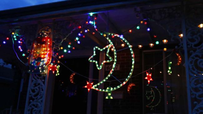 FILE- In a file photo from Tuesday, April 28, 2020, Ramadan lights are displayed on a house in Dearborn, Mich. The Muslim community in Dearborn is starting a new tradition this year. The community is hosting a Ramadan lights competition in hopes of spreading joy and bringing back some of the holiday spirit during the coronavirus pandemic. (AP Photo/Carlos Osorio, File)