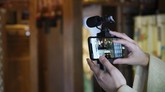 Kuil Shinto di Jepang Hibur Mereka yang Dirumah Aja In this May 8, 2020, photo, a priest prepares a livestream prayer during a 10-day trial of