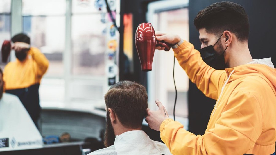 Businessman in barber shop