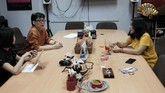 Panggung Digital Untuk Penari Indonesia Indonesian choreographers Rusdy Rukmarata, left, and Yola Yulfianti talk during a meeting at Rukmarata's office in Jakarta, Indonesia Wednesday, May 13, 2020. Rukmarata and Yulfianti are helping fellow dancers who lost their jobs due to the new coronavirus outbreak in the country by setting up the YouTube channel as a platform where dancers, choreographers and dance teachers can perform, then receive donation from viewers. (AP Photo/Dita Alangkara)