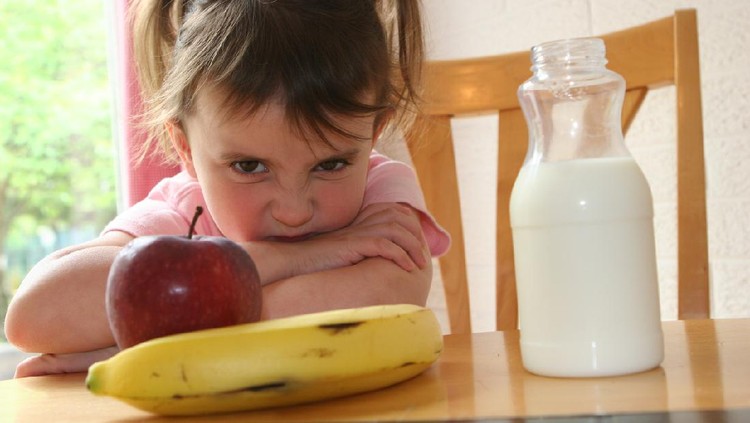 Little Girl refusing to eat healthy lunch/snack of fruit and drink her milk
