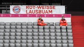 FBL-GER-BUNDESLIGA-BAYERN MUNICH-DUESSELDORF Medical personell sit in an empty tribune ahead of the German first division Bundesliga football match FC Bayern Munich v Fortuna Duesseldorf on May 30, 2020 in Munich, southern Germany. (Photo by Christof STACHE / various sources / AFP) / DFL REGULATIONS PROHIBIT ANY USE OF PHOTOGRAPHS AS IMAGE SEQUENCES AND/OR QUASI-VIDEO
