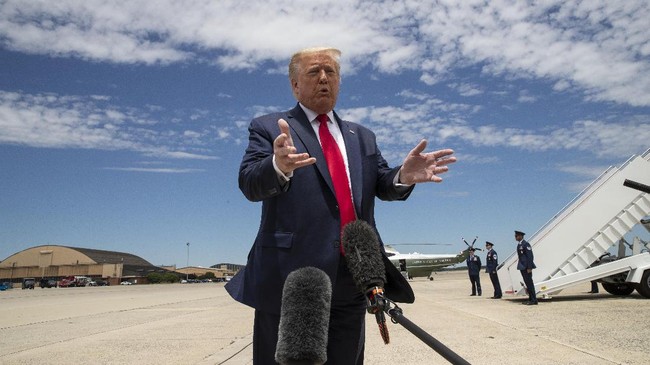 President Donald Trump speaks with reporters before boarding Air Force One as he departs Saturday, May 30, 2020, at Andrews Air Force Base, Md. Trump is en route to Kennedy Space Center for the SpaceX Falcon 9 Launch. (AP Photo/Alex Brandon)