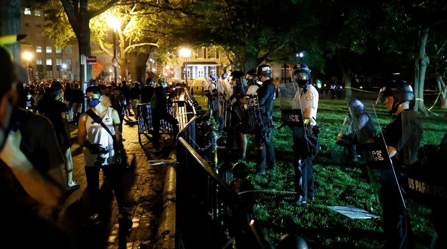 Demonstrators gather to protest the death of George Floyd, Saturday, May 30, 2020, near the White House in Washington. Floyd died after being restrained by Minneapolis police officers. (AP Photo/Alex Brandon)