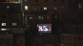 Layar Tancep, Pelipur Lara Kala Pandemi di Caracas The film Aladdin is projected on a screen set up on the roof of a home in the Petare neighborhood of Caracas, Venezuela, Monday, June 1, 2020. A neighborhood group called The Download Zone set up the movie as a free entertainment option for families cooped up since mid-March under the COVID-19 quarantine. (AP Photo/Ariana Cubillos)