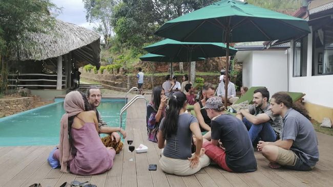 ADDS PHOTOGRAPHER BYLINE - In this April, 2020, photo, stranded tourists rest at the Cafe Chill in Ella, a tourist hot spot about 200 kilometers (120 miles) east of the capital Colombo, Sri Lanka. When flights were canceled and airports shut down, cafe owner Darshana Ratnayake decided to organize free food and shelter for several dozen stranded tourists. “We were totally blown away,” one of the tourists, 31-year-old cruise line entertainment director Alex Degmetich, said of the gesture. 40 tourists were stranded in Ella after the Sri Lankan government imposed a nationwide curfew on March 20 to curb the spread of the virus, sealing off entire regions of the Indian Ocean island nation. (Emma Hung/Cafe Chill via AP)