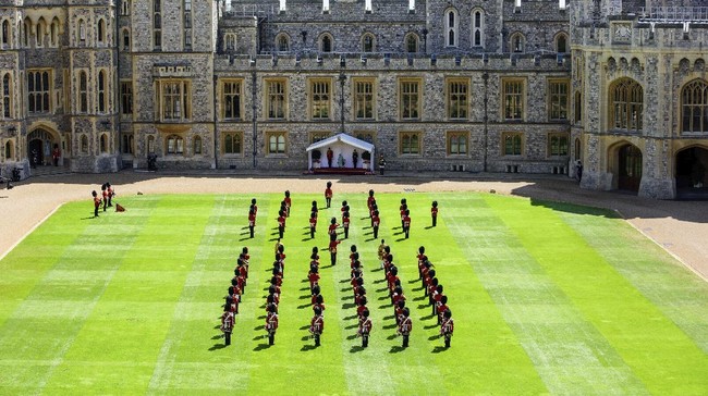 Britain's Queen Elizabeth II attends a ceremony to mark her official birthday at Windsor Castle in Windsor, England, Saturday June 13, 2020. Queen Elizabeth II’s birthday is being marked with a smaller ceremony than usual this year, as the annual Trooping the Color parade is canceled amid the coronavirus pandemic. (Joanne Davidson/Pool via AP)