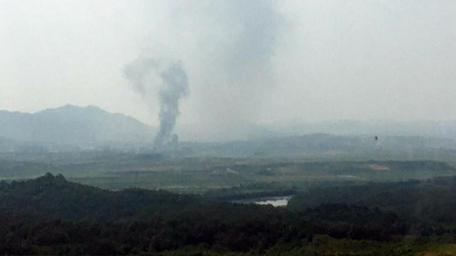 Smoke rises in the North Korean border town of Kaesong, seen from Paju, South Korea, Tuesday, June 16, 2020. South Korea says that North Korea has exploded an inter-Korean liaison office building just north of the tense Korean border. (Yonhap via AP)