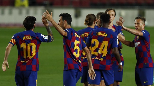 Barcelona's players celebrate Ansu Fati's goal during the Spanish La Liga soccer match between FC Barcelona and Leganes at the Camp Nou stadium in Barcelona, Spain, Tuesday, June 16, 2020. (AP Photo/Joan Montfort)