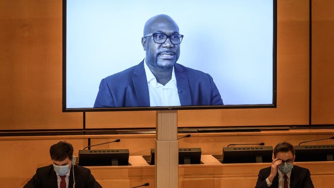 A TV screen displays George Floyd's brother, Philonise Floyd speaking via video message during an urgent debate on 