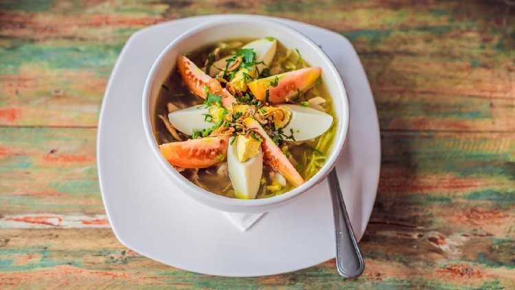 Soto is a traditional Indonesian soup mainly composed of broth, chicken and vegetables.
