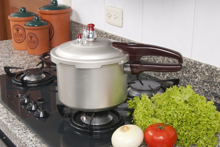 panci presto Pressure cooker; photo about stove in the kitchen.