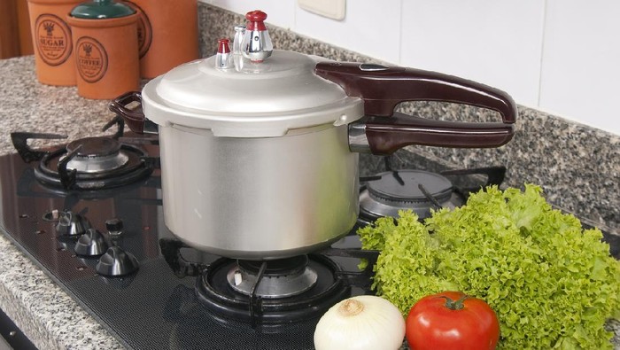 Pressure cooker; photo about stove in the kitchen.