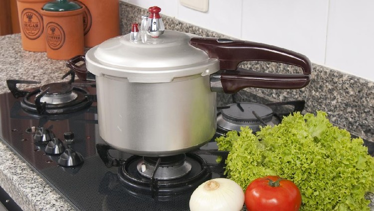 Pressure cooker; photo about stove in the kitchen.