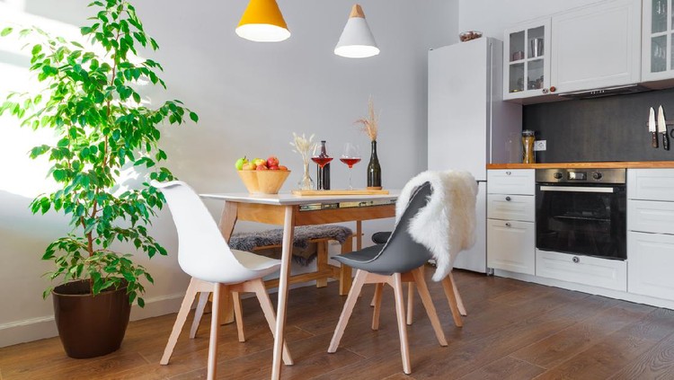 Ruang makan rumah minimalis Modern interior cozy kitchen, dining room, white furniture, lamps, wooden table, red wine, glasses. Concept decor, design, advert, credit, mortgage, house for young family, magazine cover