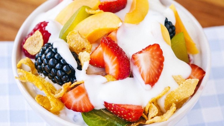 Fruit salad with rasberries, strawberries, blackberries, green plums and apricots