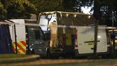 Teror Penusukan di Inggris Forensic officers work at Forbury Gardens park where a summer-evening stabbing attack took place Saturday, in Reading, England, early Sunday June 21, 2020. (Steve Parsons/PA via AP)