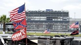 Bubba Wallace FILE - In this July 4, 2015, file photo, confederate and American flags fly on top of motor homes at Daytona International Speedway in Daytona Beach, Fla. Bubba Wallace, the only African-American driver in the top tier of NASCAR, calls for a ban on the Confederate flag in the sport that is deeply rooted in the South. (AP Photo/Phelan M. Ebenhack, File)