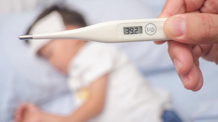 1175384289 Fever, Close-up medical thermometer, Parent / Father measuring temperature of his ill kid, Asian 3 - 4 years old toddler boy gets high fever lying on bed with cold compress on forehead to cool a fever