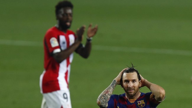 Barcelona's Lionel Messi gestures during the Spanish La Liga soccer match between FC Barcelona and Athletic Bilbao at the Camp Nou stadium in Barcelona, Spain, Tuesday, June 23, 2020. (AP Photo/Joan Monfort)