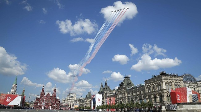 Russian warplanes fly over Red Square leaving trails of smoke in colors of national flag during the Victory Day military parade marking the 75th anniversary of the Nazi defeat in Moscow, Russia, Wednesday, June 24, 2020. The Victory Day parade normally is held on May 9, the nation's most important secular holiday, but this year it was postponed due to the coronavirus pandemic. (AP Photo/Alexander Zemlianichenko)