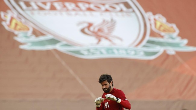 Liverpool's goalkeeper Alisson before the English Premier League soccer match between Liverpool and Crystal Palace at Anfield Stadium in Liverpool, England, Wednesday, June 24, 2020. (/Pool via AP)