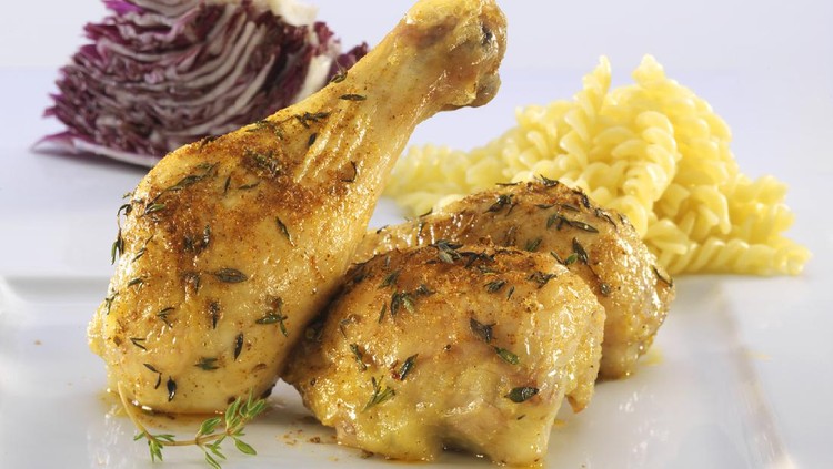Chicken legs with pasta and lettuce