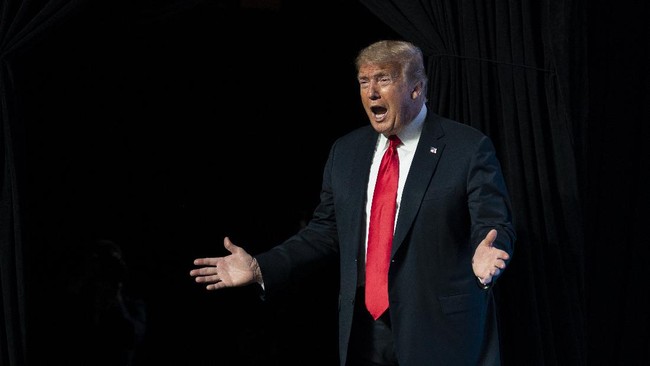 In this June 23, 2020, photo, President Donald Trump arrives to speak to a group of young Republicans at Dream City Church in Phoenix. Trump is sharpening his focus on his ardent base of supporters as polls show a diminished standing for the president in battleground states that will decide the 2020 election (AP Photo/Evan Vucci)