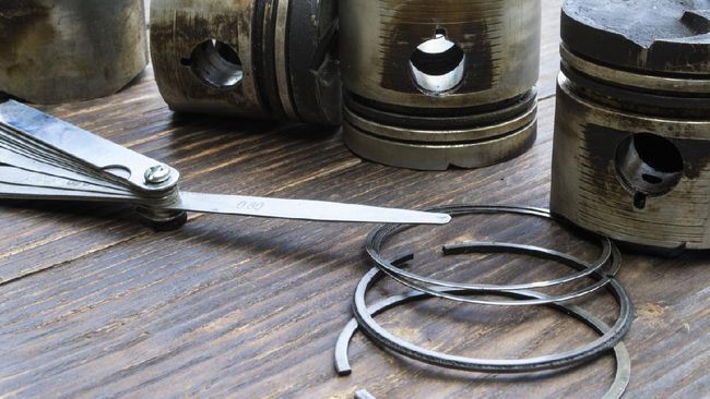 piston ring Old car engine pistons.
