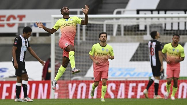 Manchester City's Raheem Sterling celebrates after scoring his side's second goal during the FA Cup sixth round soccer match between Newcastle United and Manchester City at St. James' Park in Newcastle, England, Sunday, June 28, 2020. (Shaun Botterill/Pool via AP)