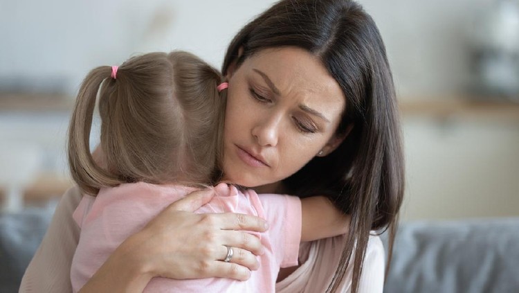 Worried young foster care parent mother comforting solacing embrace adopted little child daughter give care and protection at home, loving concerned adult mom hug sad small girl consoling kid concept