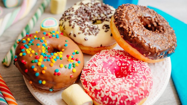 Image of multi colour glazed donuts