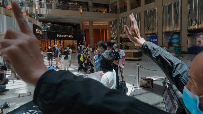 Protesters gather at a shopping mall in Central during a pro-democracy protest against Beijing's national security law in Hong Kong, Tuesday, June 30, 2020. Hong Kong media are reporting that China has approved a contentious law that would allow authorities to crack down on subversive and secessionist activity in Hong Kong, sparking fears that it would be used to curb opposition voices in the semi-autonomous territory. (AP Photo/Vincent Yu)