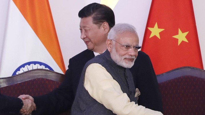 In this Oct. 16, 2016, file photo, Indian Prime Minister Narendra Modi, front and Chinese President Xi Jinping shake hands with leaders at the BRICS summit in Goa, India. Modi made an unannounced visit Friday, July 3, 2020, to a military base in remote Ladakh region bordering China where the soldiers of the two countries have been facing off for nearly two months. Modi’s visit comes in the backdrop of massive Indian army build-up in Ladakh region following hand-to-hand combat between Indian and Chinese soldiers on June 15 that left 20 Indian soldiers dead and dozens injured, the worst military confrontation in over four decades between the Asian giants. (AP Photo/Manish Swarup, File)