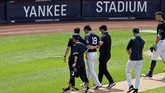 masahiro tanaka New York Yankees pitcher Masahiro Tanaka (19) is helped off the field by team medical personnel after being hit by a ball off the bat of Yankees Giancarlo Stanton during a baseball a workout at Yankee Stadium in New York, Saturday, July 4, 2020. (AP Photo/Adam Hunger)