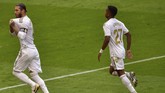 Athletic Bilbao vs Real Madrid Real Madrid's Sergio Ramos, left, celebrates after scoring the opening goal from a penalty shoot during the Spanish La Liga soccer match between Athletic Club and Real Madrid at the San Manes stadium in Bilbao, Spain, Sunday, July 5, 2020. (AP Photo/Alvaro Barrientos)