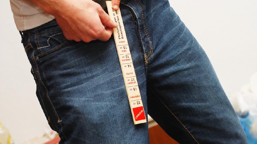 man with blue jeans close up