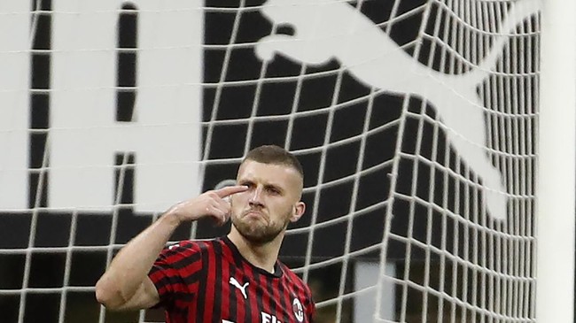 AC Milan's Ante Rebic celebrates his goal against Juventus during the Serie A soccer match between AC Milan and Juventus at the San Siro stadium, in Milan, Italy, Tuesday, July 7, 2020. (AP Photo/Antonio Calanni)