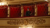 Opera La Scala Buka Kembali A usher wearing a mask looks down prior to a show at the La Scala theater in Milan Italy, Monday, July 6, 2020. La Scala opera house reopened Monday after a four-month shutdown due to the COVID-19 restriction measures. (AP Photo/Antonio Calanni)