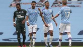 Manchester City vs Newcastle Manchester City players celebrate a goal during the English Premier League soccer match between Manchester City and Newcastle at the Ethiad Stadium in Manchester, England, Wednesday, July 8, 2020. (Lee Smith/Pool via AP)