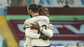 Aston Villa vs Manchester United Manchester United's Paul Pogba celebrates with teammate Bruno Fernandes after scoring his team's third goal during the English Premier League soccer match between Aston Villa and Manchester United at Villa Park in Birmingham, England, Thursday, July 9, 2020. (AP PhotoAndrew Boyers,Pool)
